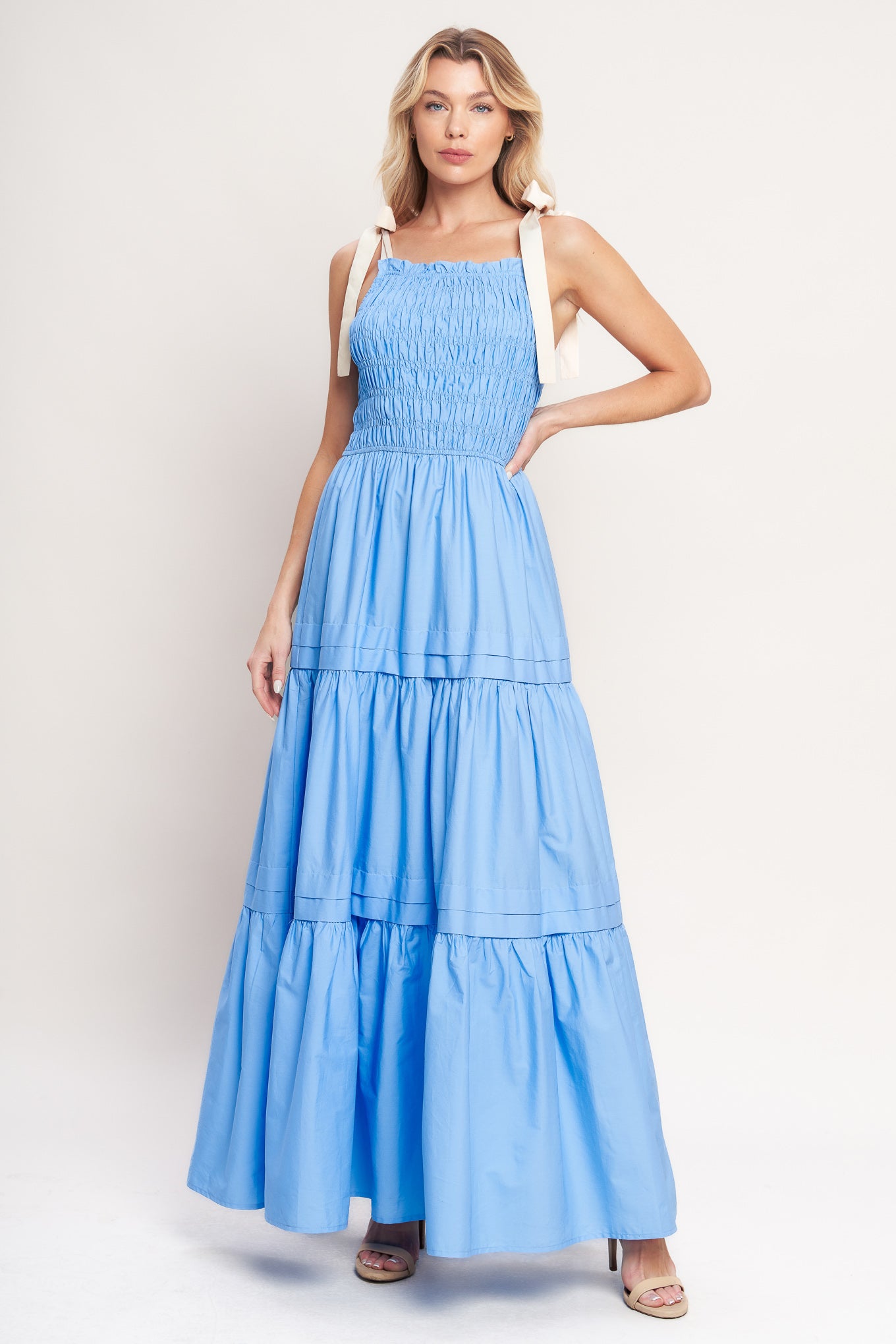 A solid woven maxi dress featuring straight neckline, shoulder ties, smocked bodice and tiered skirt

Details:

Self: 100% Cotton

Contrast: 100% Cotton

Size & Fit

-Model is 5`8" And Wearing Size Small
-Measurements Taken From Size Small
-Approx. Length: 60"