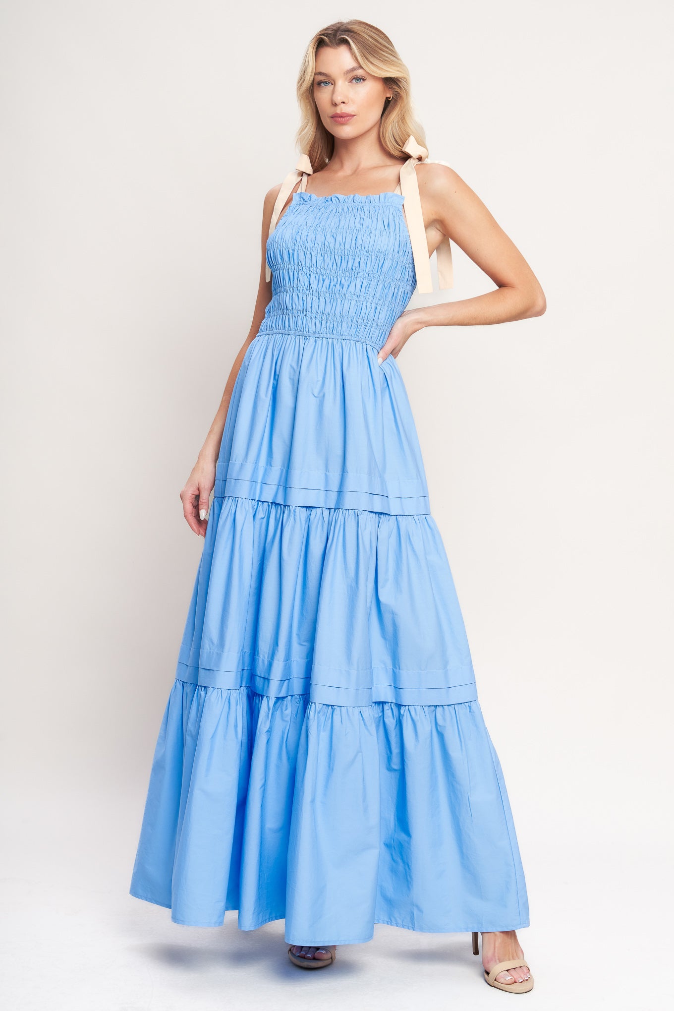 A solid woven maxi dress featuring straight neckline, shoulder ties, smocked bodice and tiered skirt

Details:

Self: 100% Cotton

Contrast: 100% Cotton

Size & Fit

-Model is 5`8" And Wearing Size Small
-Measurements Taken From Size Small
-Approx. Length: 60"
