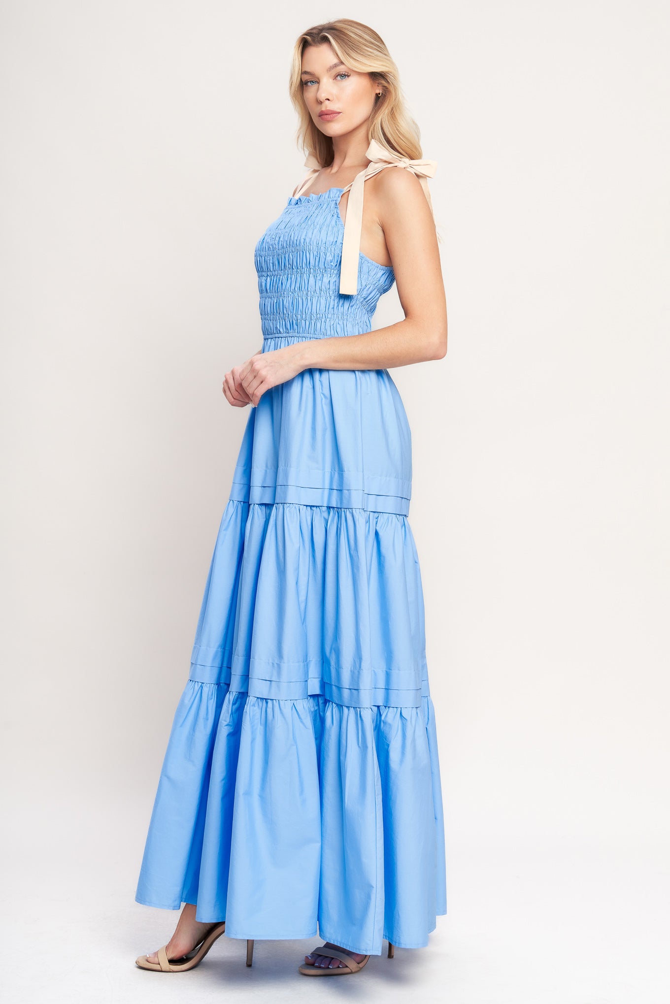 A solid woven maxi dress featuring straight neckline, shoulder ties, smocked bodice and tiered skirt

Details:

Self: 100% Cotton

Contrast: 100% Cotton

Size & Fit

-Model is 5`8" And Wearing Size Small
-Measurements Taken From Size Small
-Approx. Length: 60"