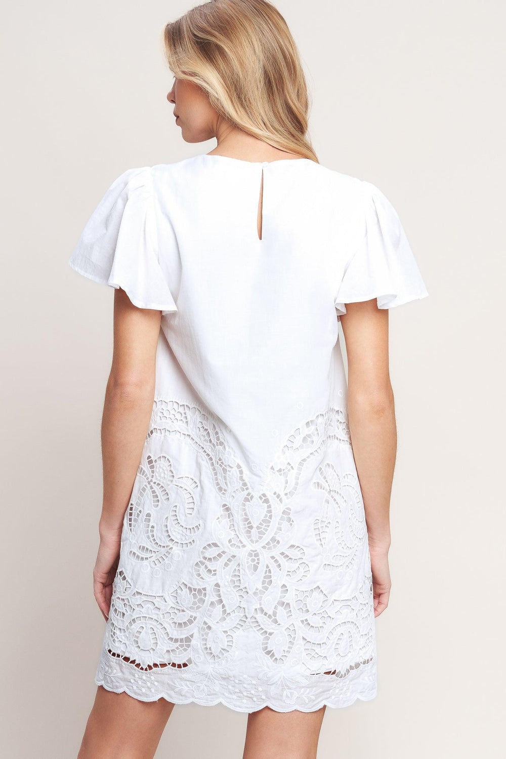 A solid woven eyelet dress with round neckline, flutter sleeve and back neck button closure

Details: 

Self: 100% Cotton

Lining: 100% Polyester

Size & Fit

-Model is 5`8" And Wearing Size Small
-Measurements Taken From Size Small
-Approx. Length: 35"