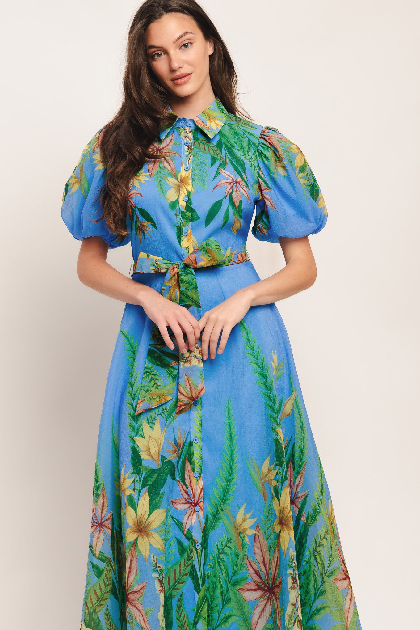 A printed woven midi dress featuring collar, short puff sleeve, button down, circle skirt and self sash tie

Details:

Self: 100% Polyester

Lining: 100% Polyester

Size & Fit

-Model is 5`8" And Wearing Size Small
-Measurements Taken From Size Small
-Approx. Length: 54"