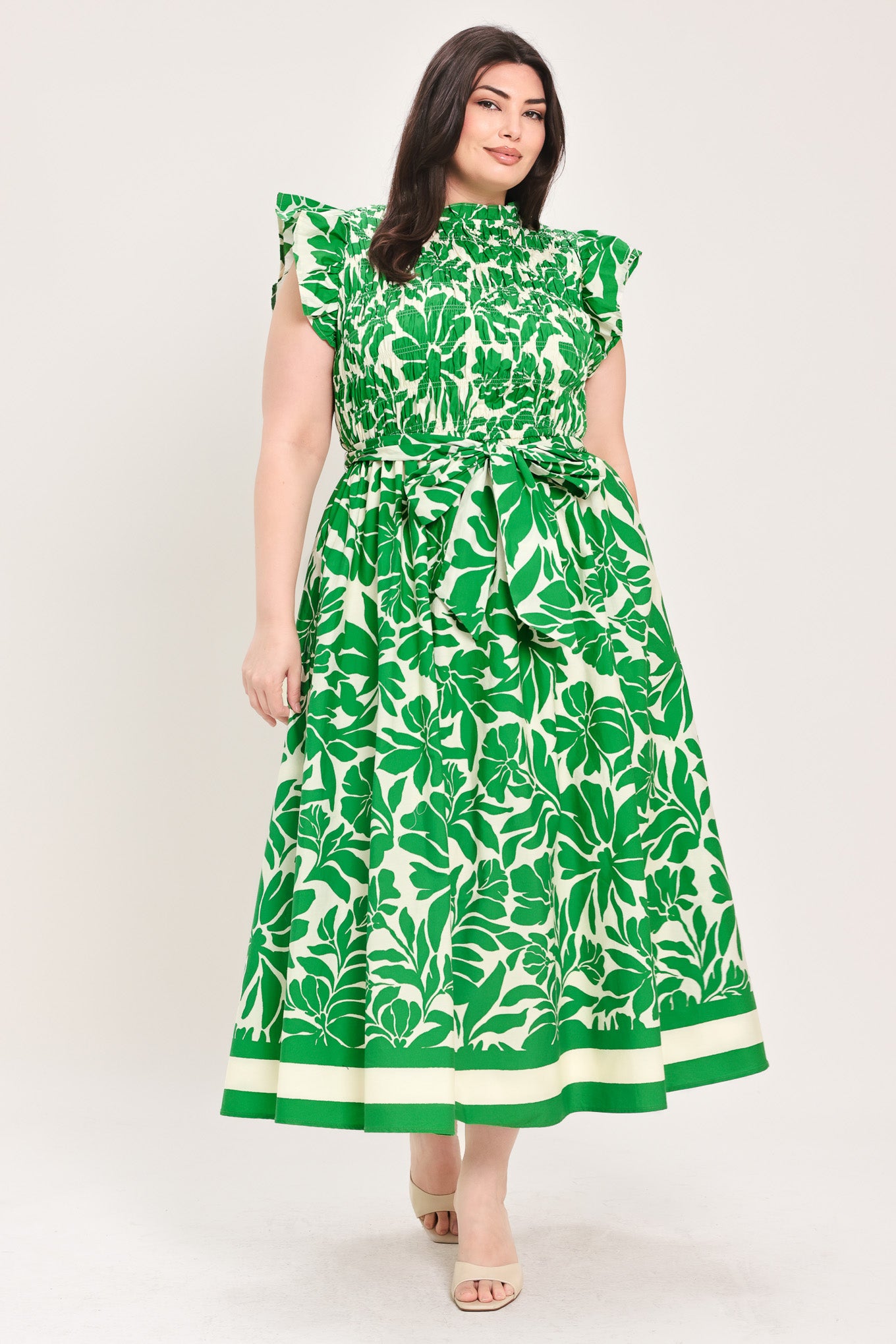 Woman wearing green floral midi dress | Flying Tomato