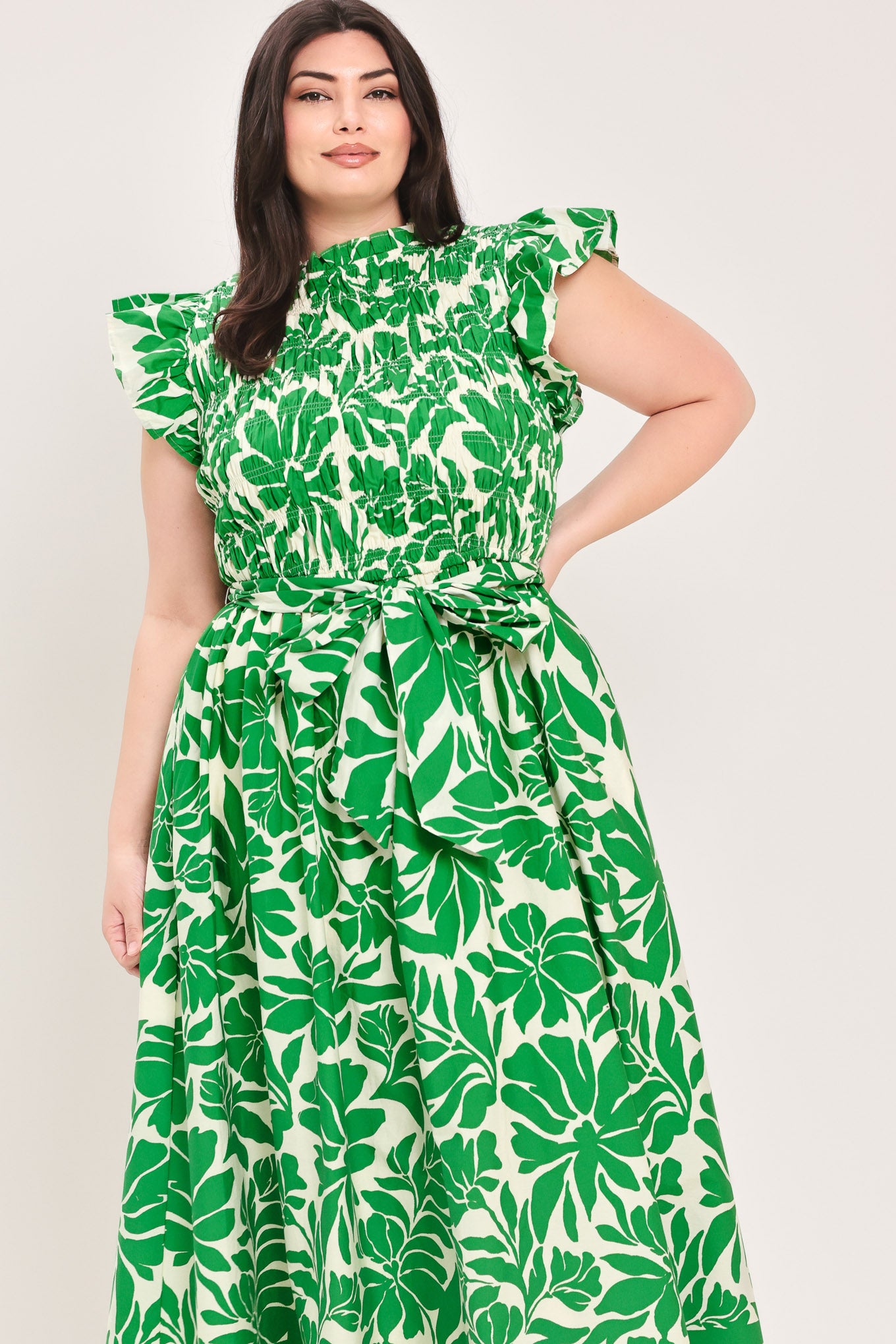 Woman wearing green floral midi dress | Flying Tomato