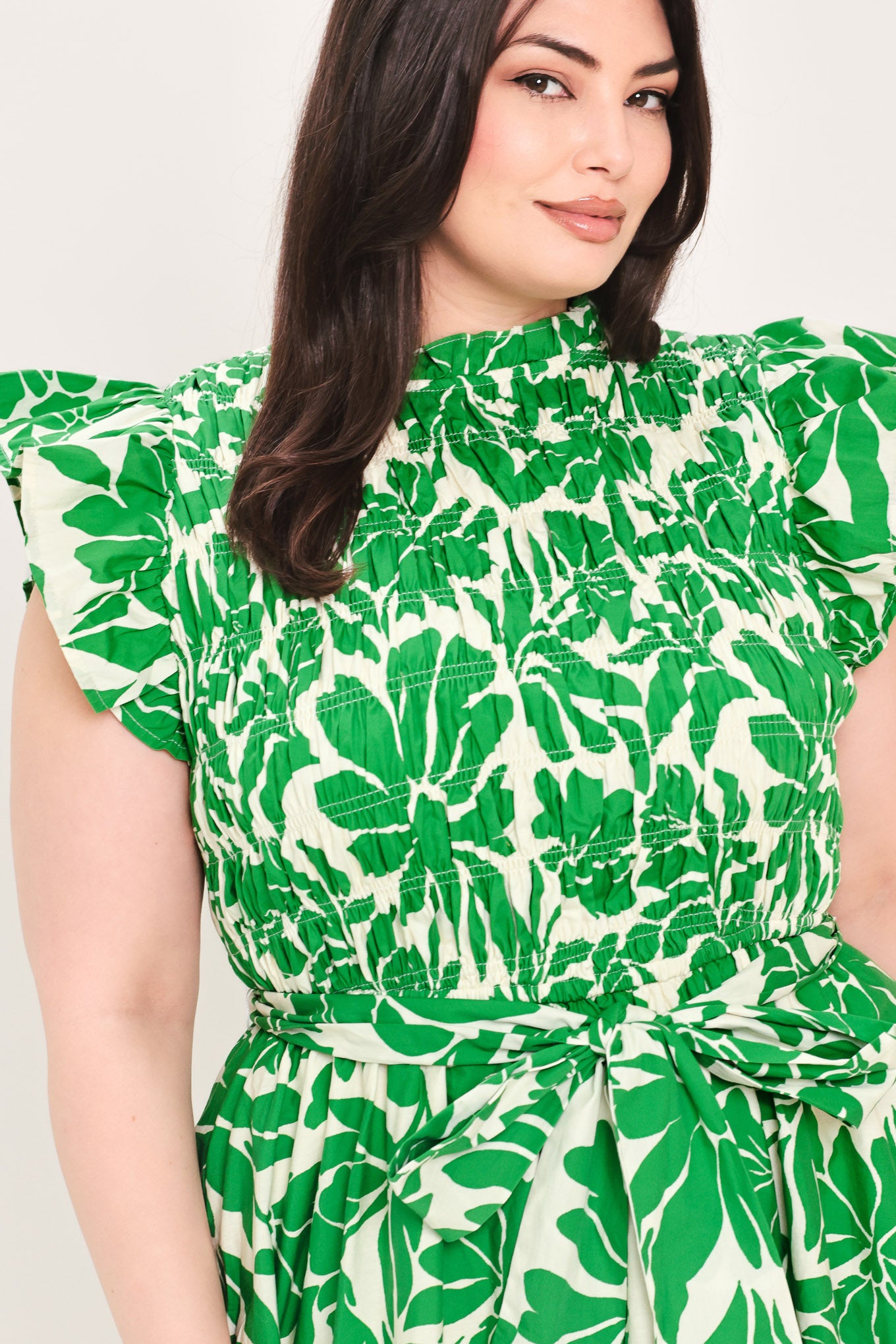 Woman wearing green floral midi dress | Flying Tomato