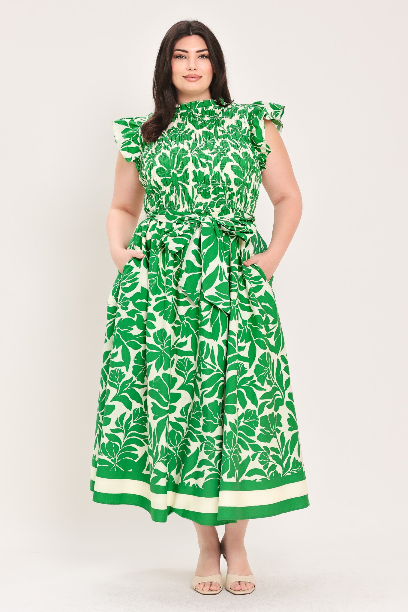 Woman wearing green floral midi dress | Flying Tomato