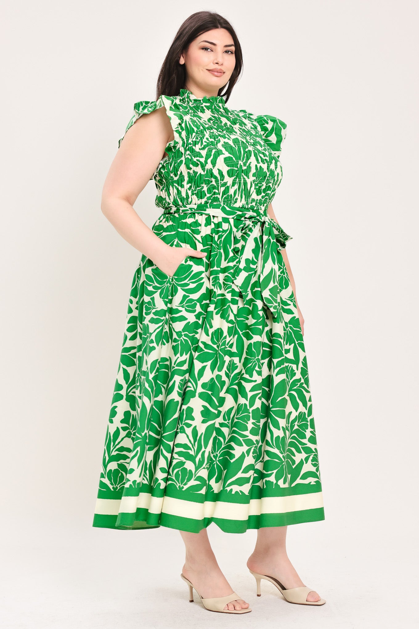 Woman wearing green floral midi dress | Flying Tomato