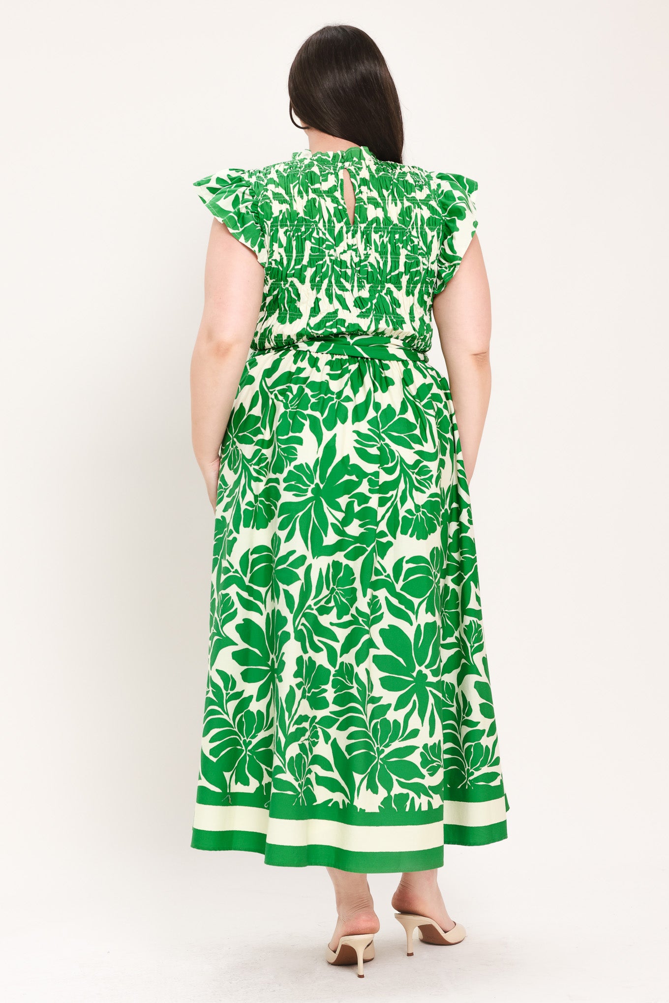 Woman wearing green floral midi dress | Flying Tomato