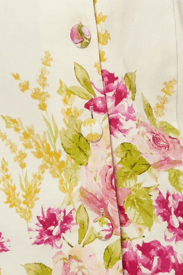 Close-up of a floral patterned fabric with pink and green flowers on a beige background | Flying Tomato
