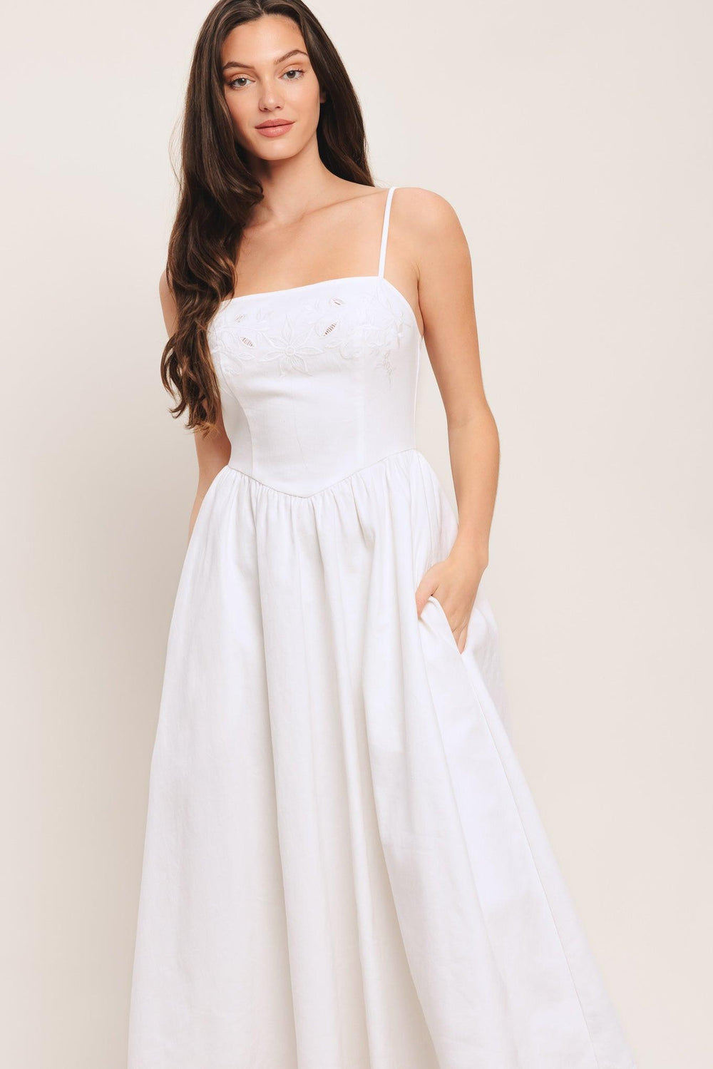 A solid woven midi dress featuring straight neckline, straps, embroidered bodice, basque waist and back zipper closure

Details:

Self: 97% Cotton 3% Spandex

Size & Fit

-Model is 5`8" And Wearing Size Small
-Measurements Taken From Size Small
-Approx. Length: 48"