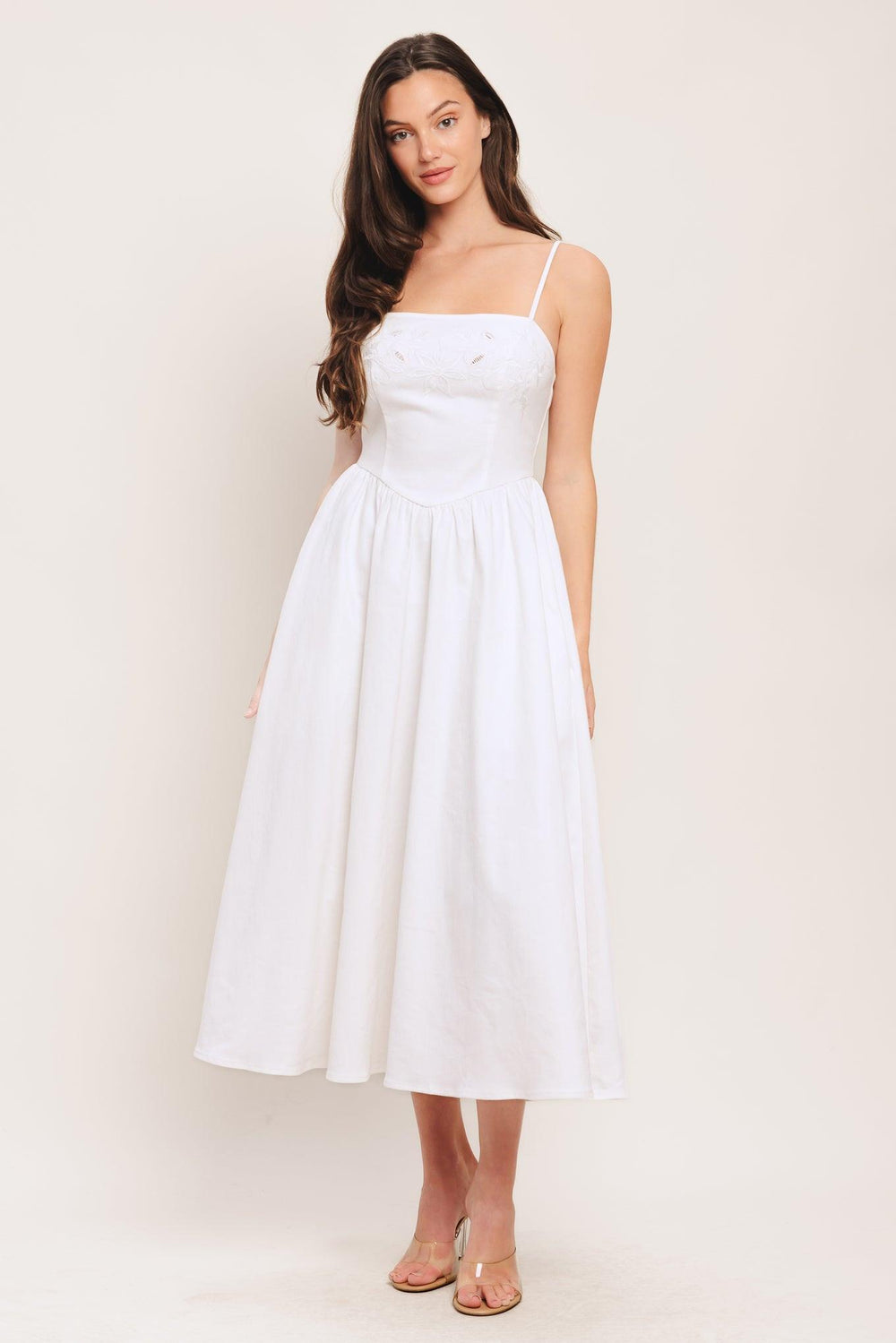 A solid woven midi dress featuring straight neckline, straps, embroidered bodice, basque waist and back zipper closure

Details:

Self: 97% Cotton 3% Spandex

Size & Fit

-Model is 5`8" And Wearing Size Small
-Measurements Taken From Size Small
-Approx. Length: 48"