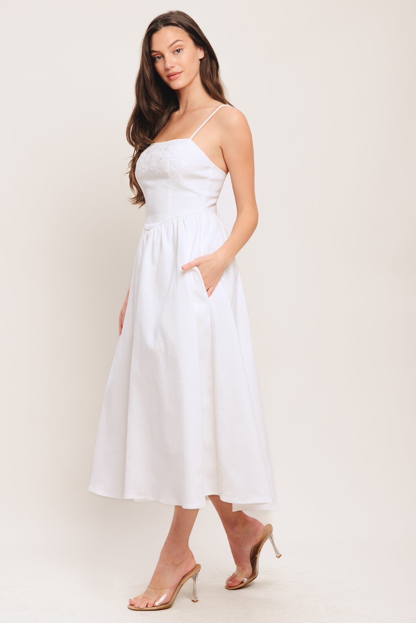 A solid woven midi dress featuring straight neckline, straps, embroidered bodice, basque waist and back zipper closure

Details:

Self: 97% Cotton 3% Spandex

Size & Fit

-Model is 5`8" And Wearing Size Small
-Measurements Taken From Size Small
-Approx. Length: 48"