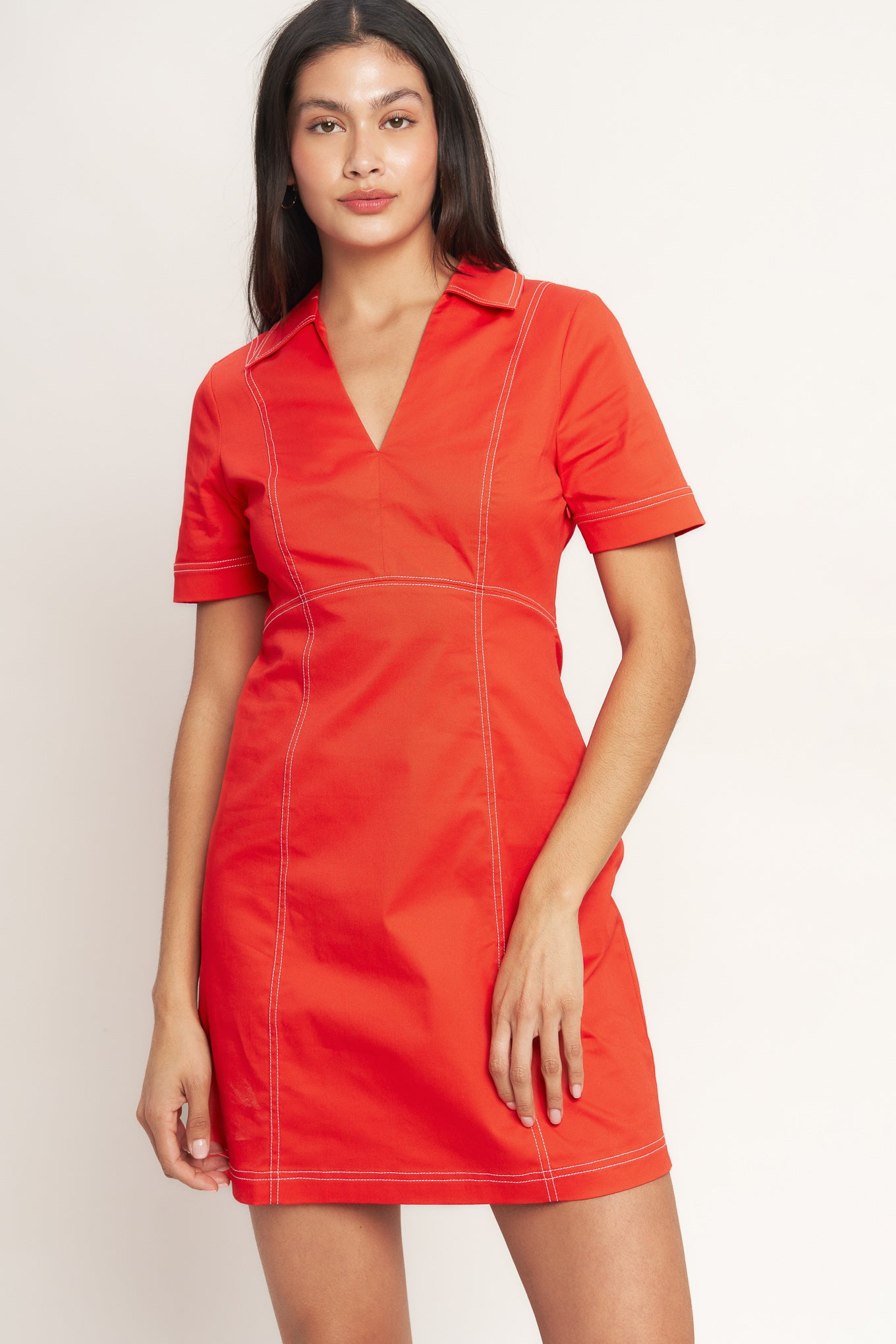 
A solid woven mini dress featuring collar, V neckline, short sleeve and side zipper closure

Details:

Self : 97% Cotton 3% Spandex

Size &amp; Fit

- Model is 5`8" And Wearing Size Small
- Measurements Taken From Size Small
- Approx. Length: 35" Flying Tomato