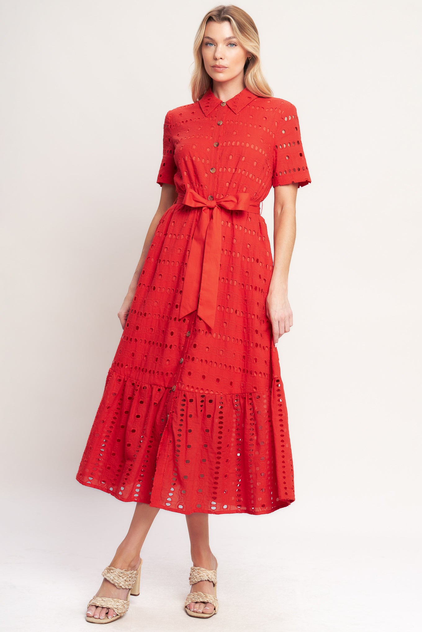 A woven eyelet midi dress featuring collar, short sleeve, front button down, self sash and ruffle hem

Details:

Self: 100% Cotton

Contrast: 100% Cotton

Lining: 100% Polyester

Size & Fit

-Model is 5`8" And Wearing Size Small
-Measurements Taken From Size Small
-Approx. Length: 51"