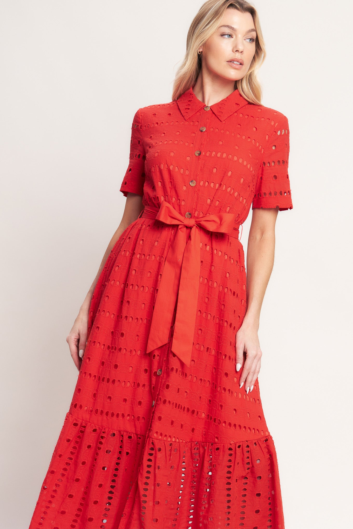A woven eyelet midi dress featuring collar, short sleeve, front button down, self sash and ruffle hem

Details:

Self: 100% Cotton

Contrast: 100% Cotton

Lining: 100% Polyester

Size & Fit

-Model is 5`8" And Wearing Size Small
-Measurements Taken From Size Small
-Approx. Length: 51"