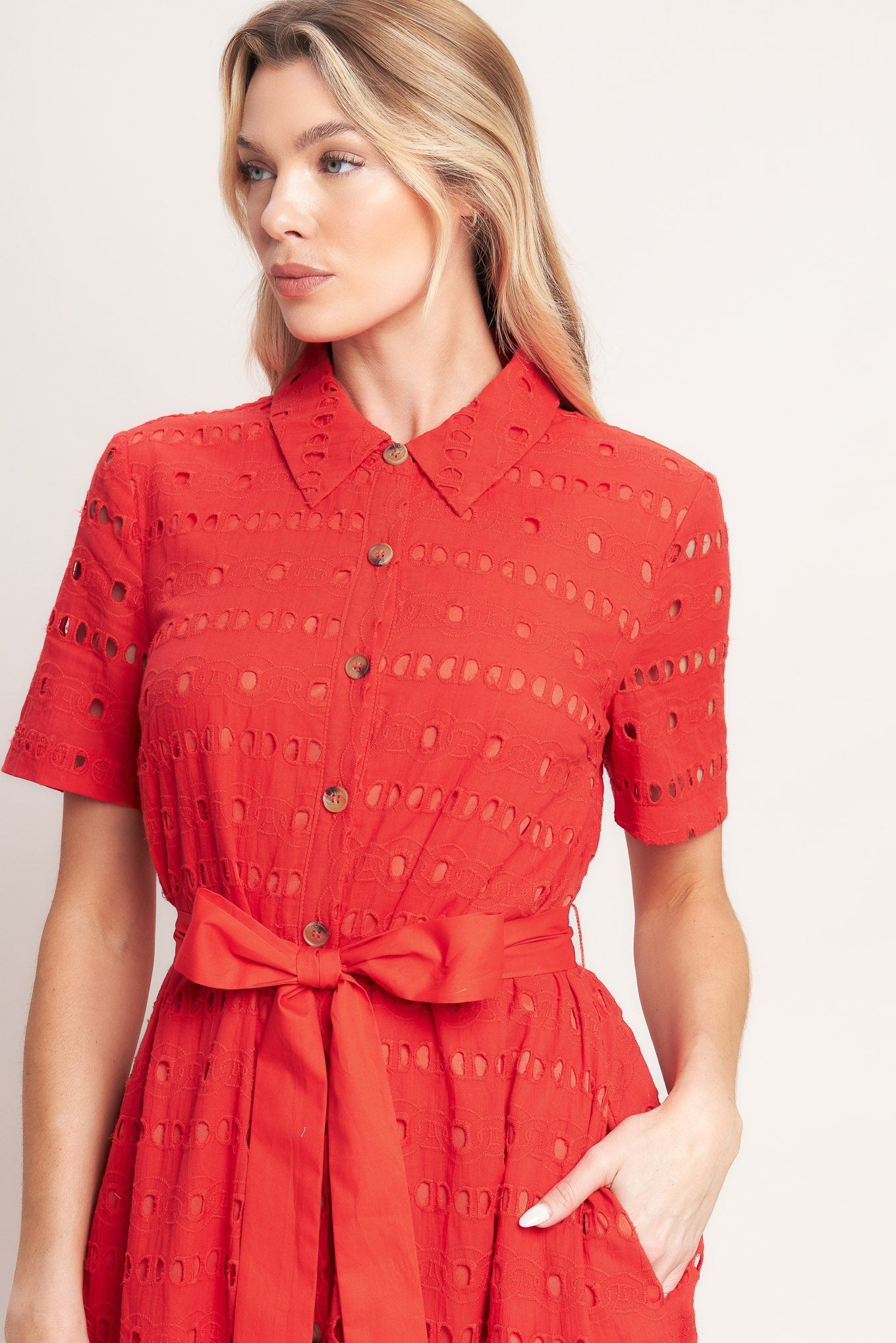 A woven eyelet midi dress featuring collar, short sleeve, front button down, self sash and ruffle hem

Details:

Self: 100% Cotton

Contrast: 100% Cotton

Lining: 100% Polyester

Size & Fit

-Model is 5`8" And Wearing Size Small
-Measurements Taken From Size Small
-Approx. Length: 51"