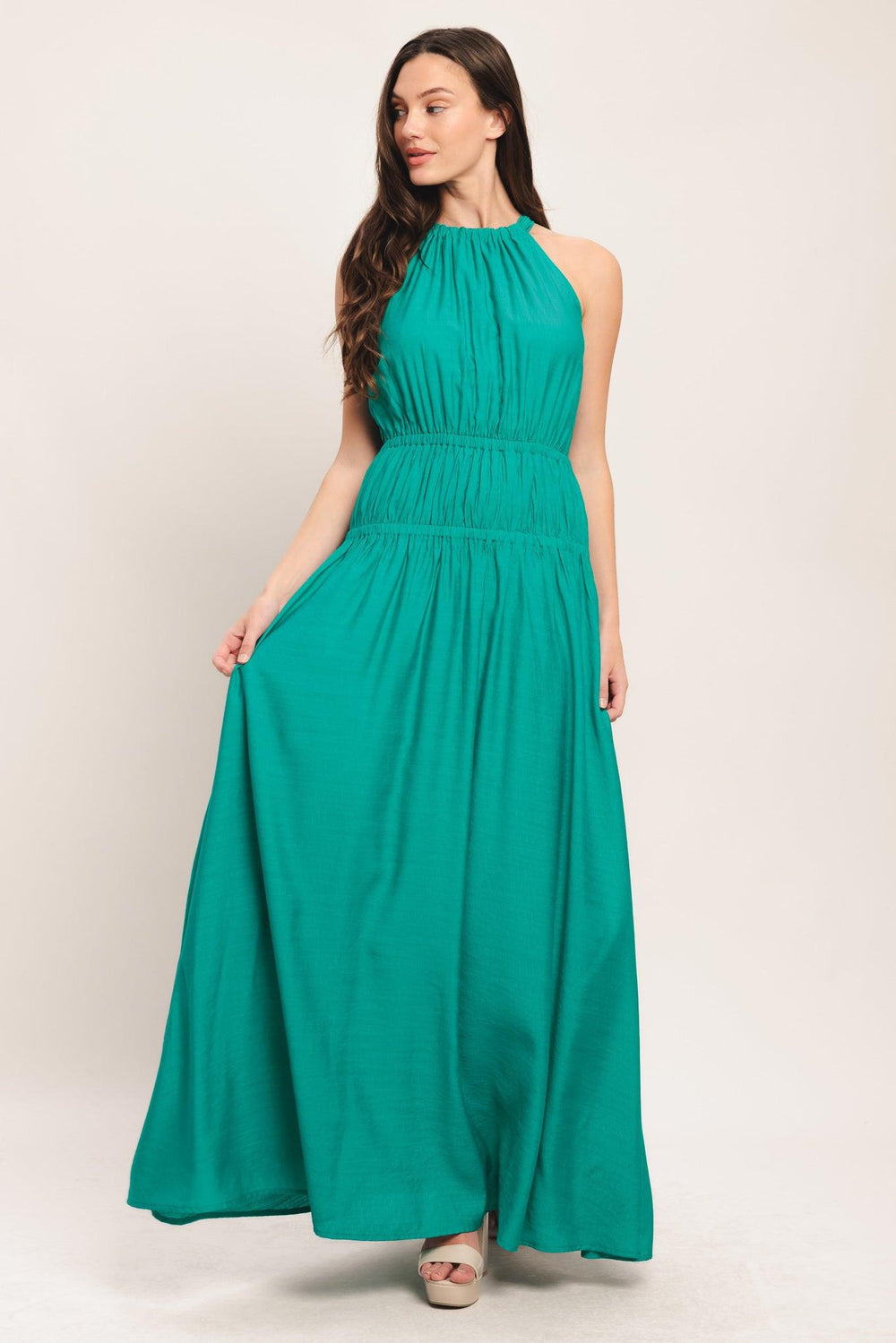 A solid woven maxi dress featuring halter neckline with back tie and elastic waist

Details:

Self: 65% Rayon 35% Nylon

Lining: 100% Polyester

Size & Fit

-Model is 5`8" And Wearing Size Small
-Measurements Taken From Size Small
-Approx. Length: 60"