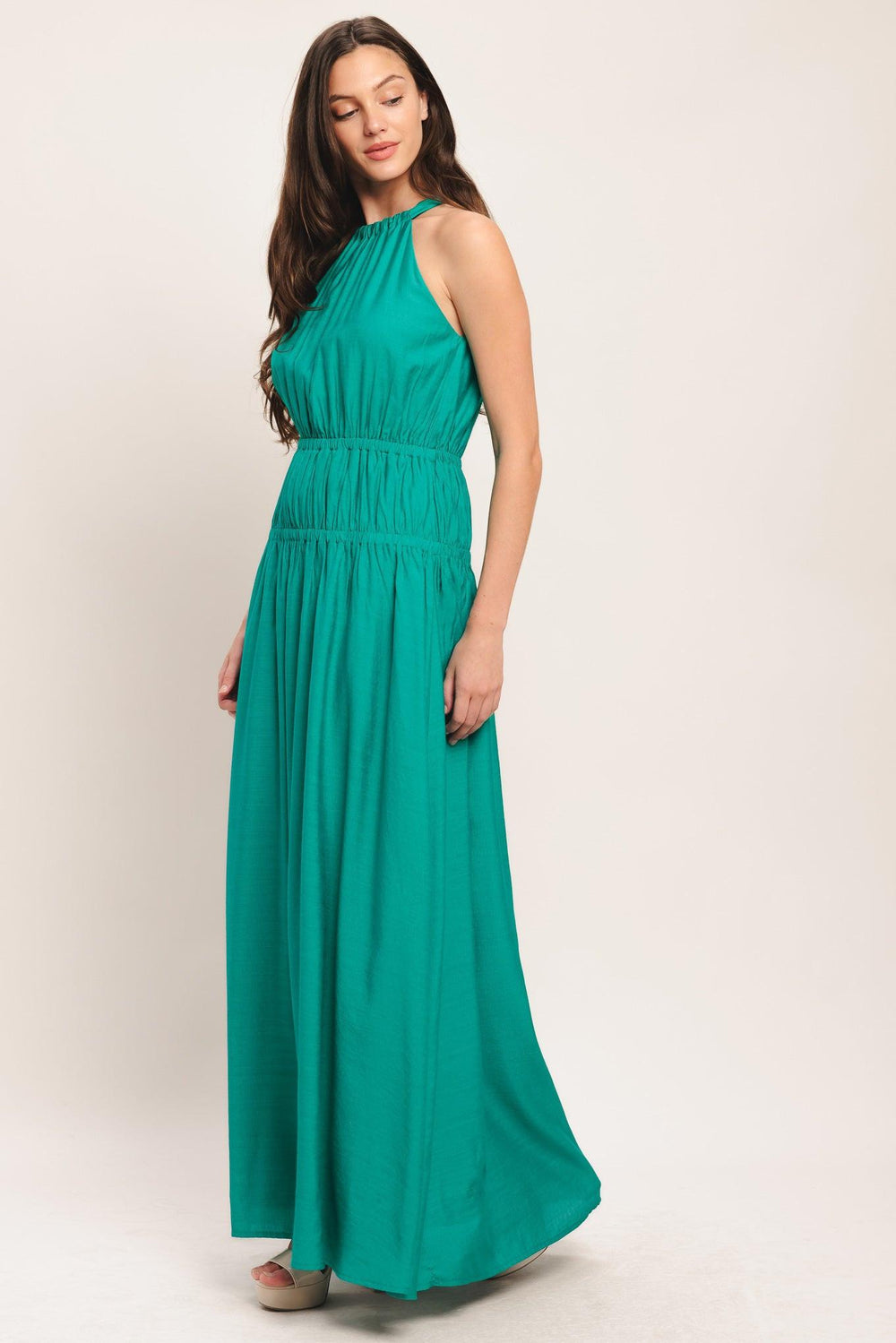 A solid woven maxi dress featuring halter neckline with back tie and elastic waist

Details:

Self: 65% Rayon 35% Nylon

Lining: 100% Polyester

Size & Fit

-Model is 5`8" And Wearing Size Small
-Measurements Taken From Size Small
-Approx. Length: 60"