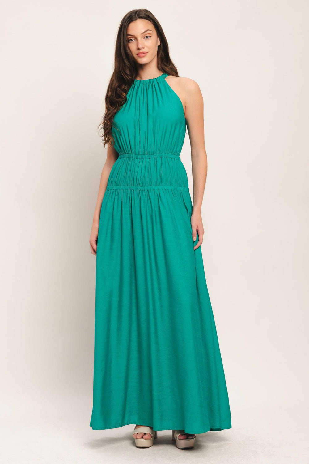 A solid woven maxi dress featuring halter neckline with back tie and elastic waist

Details:

Self: 65% Rayon 35% Nylon

Lining: 100% Polyester

Size & Fit

-Model is 5`8" And Wearing Size Small
-Measurements Taken From Size Small
-Approx. Length: 60"