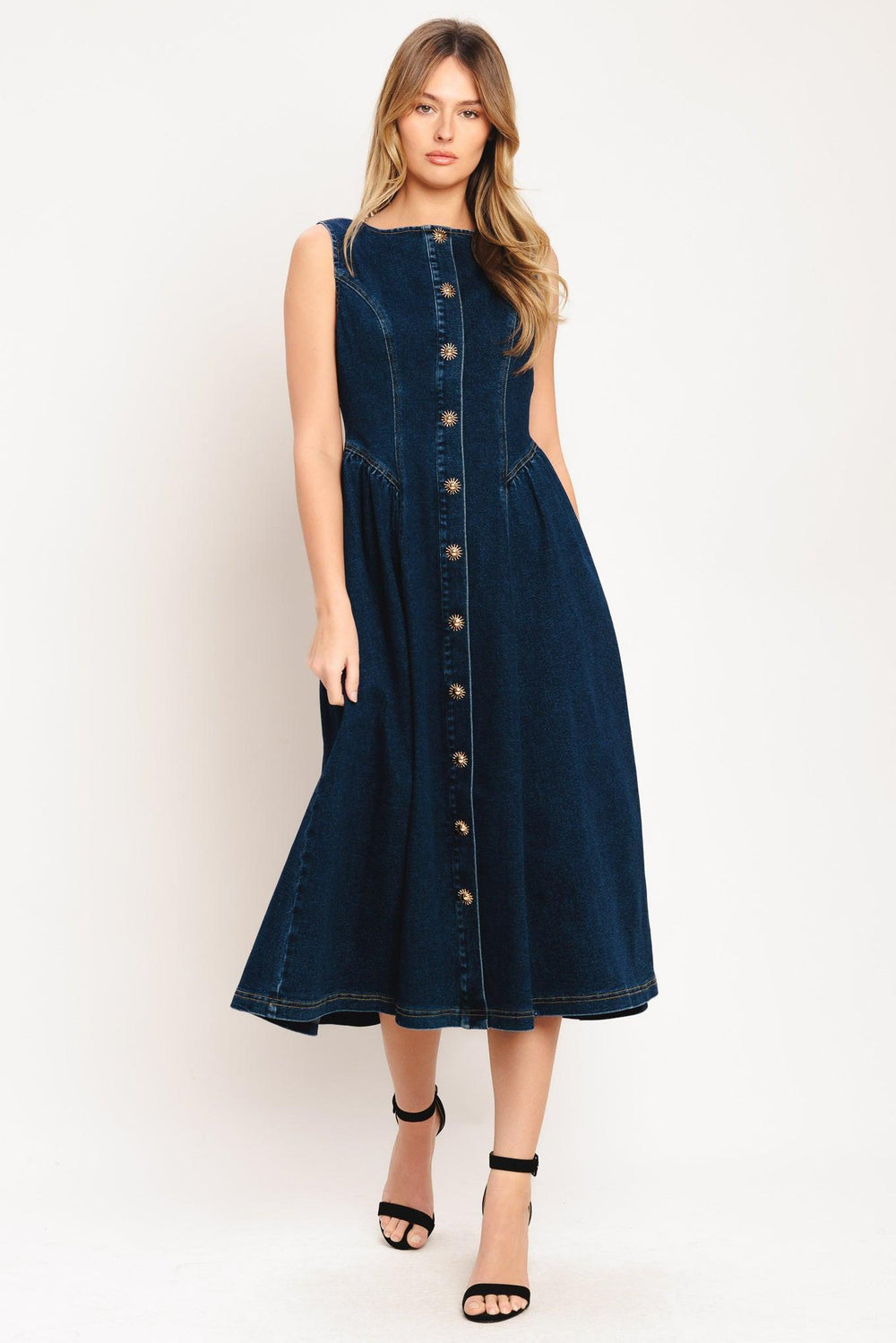 A denim midi dress featuring round neckline, sleeveless, front button down and circle skirt

Details:

Self: 55% Cotton 33% Polyester 10% Viscose 2% Spandex

Size & Fit

-Model is 5`8" And Wearing Size Small
-Measurements Taken From Size Small
-Approx. Length: 48"