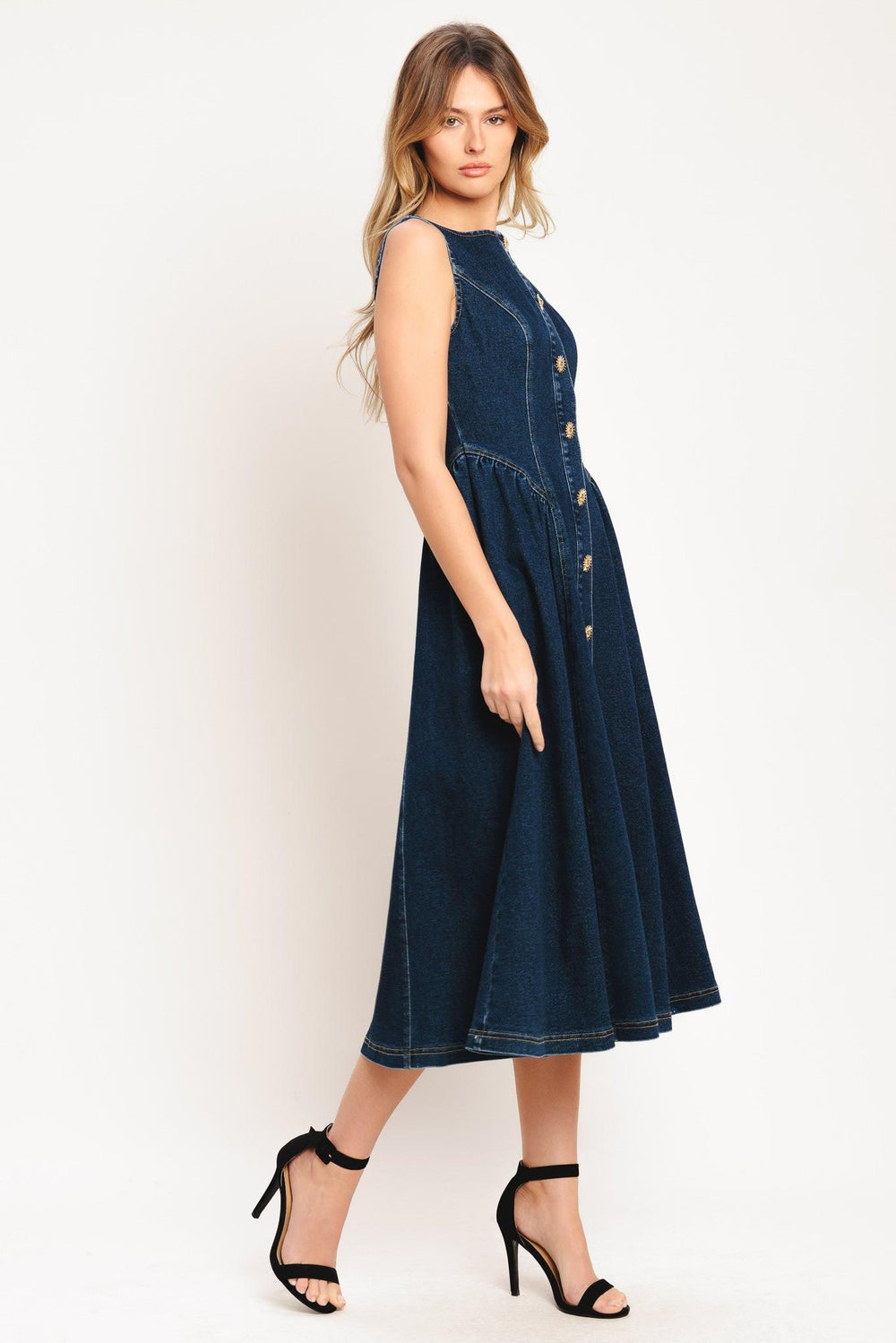 A denim midi dress featuring round neckline, sleeveless, front button down and circle skirt

Details:

Self: 55% Cotton 33% Polyester 10% Viscose 2% Spandex

Size & Fit

-Model is 5`8" And Wearing Size Small
-Measurements Taken From Size Small
-Approx. Length: 48"