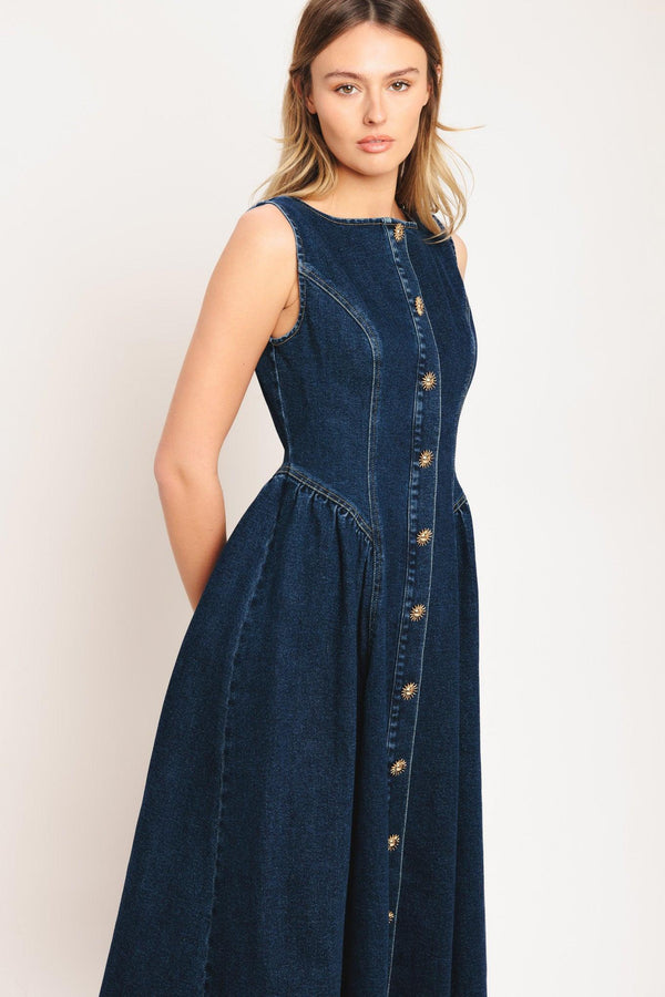 A denim midi dress featuring round neckline, sleeveless, front button down and circle skirt

Details:

Self: 55% Cotton 33% Polyester 10% Viscose 2% Spandex

Size & Fit

-Model is 5`8" And Wearing Size Small
-Measurements Taken From Size Small
-Approx. Length: 48"