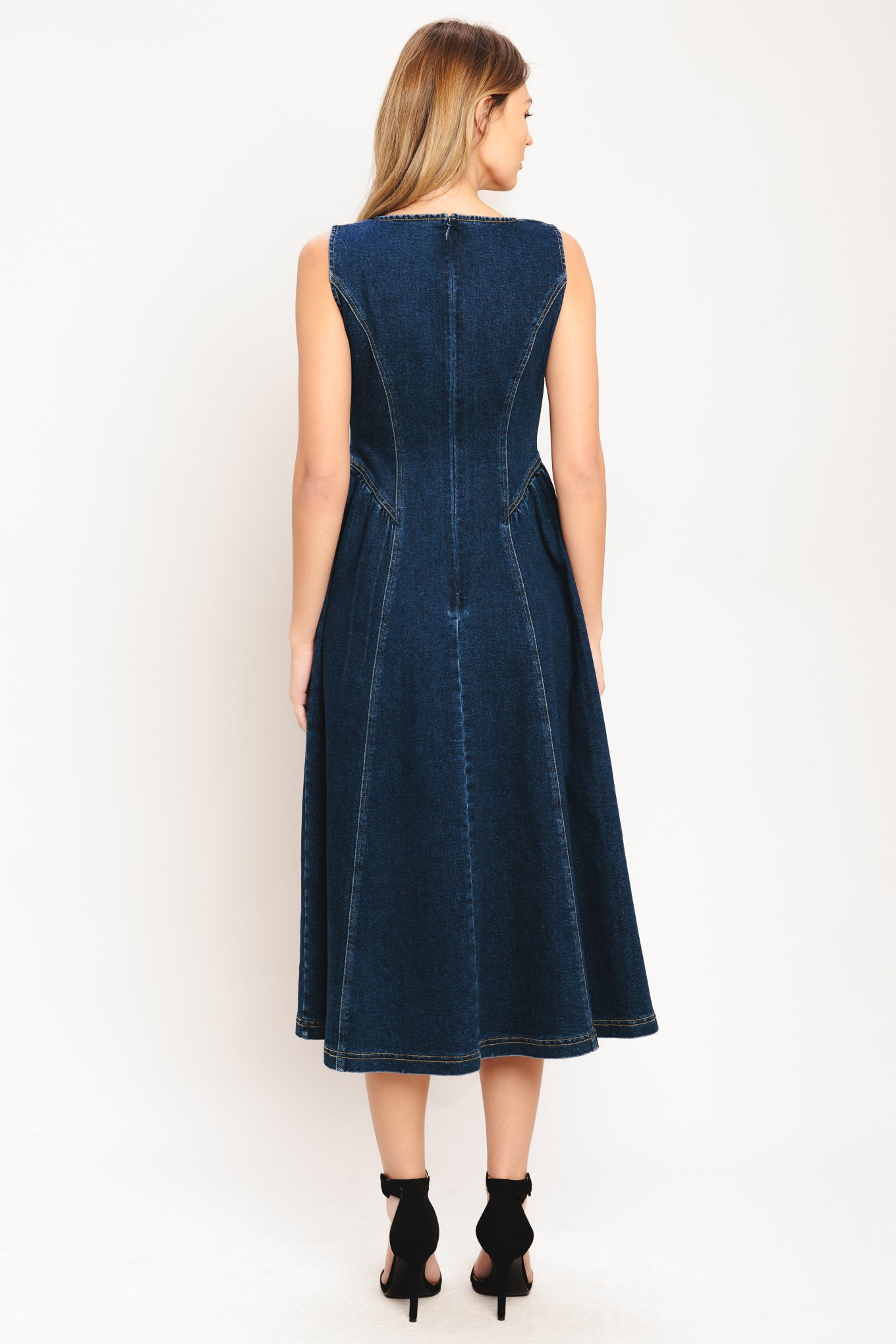 A denim midi dress featuring round neckline, sleeveless, front button down and circle skirt

Details:

Self: 55% Cotton 33% Polyester 10% Viscose 2% Spandex

Size & Fit

-Model is 5`8" And Wearing Size Small
-Measurements Taken From Size Small
-Approx. Length: 48"