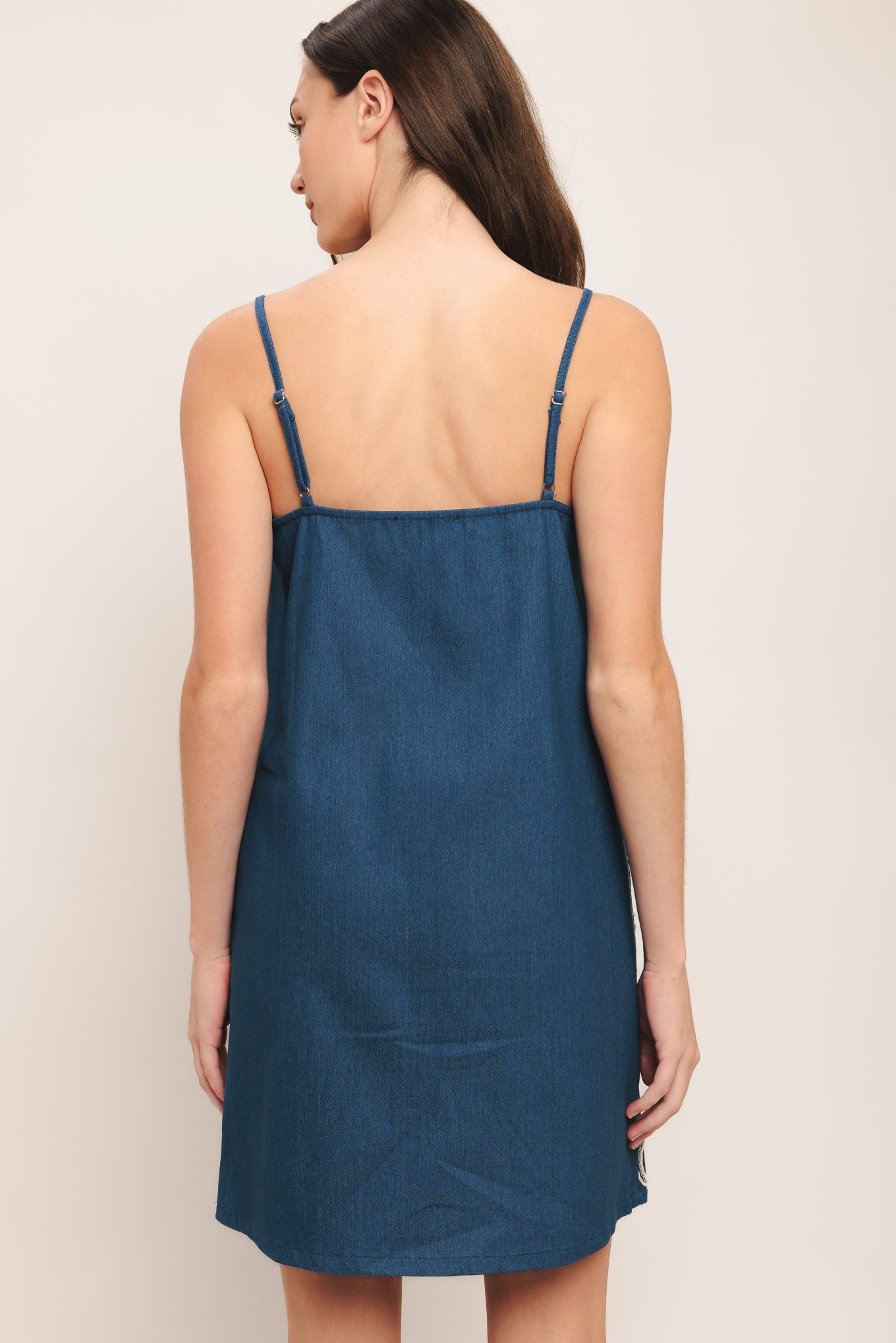 
A lightweight embroidered denim mini dress featuring straight neckline, straps and solid back

Details:

Self : 100% Cotton
Contrast : 100% Cotton

Size &amp; Fit

- Model is 5`8" And Wearing Size Small
- Measurements Taken From Size Small
- Approx. Length: 34"