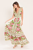 Woman wearing a floral maxi dress featuring V neckline, shoulder ties and smocked back waist band | Flying Tomato