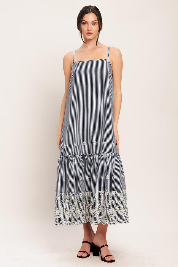 A striped woven midi dress featuring straight neckline, straps, embroidered hem, bare back with tie closure

Details:

Self: 100% Polyester

Size & Fit

-Model is 5`8" And Wearing Size Small
-Measurements Taken From Size Small
-Approx. Length: 51"