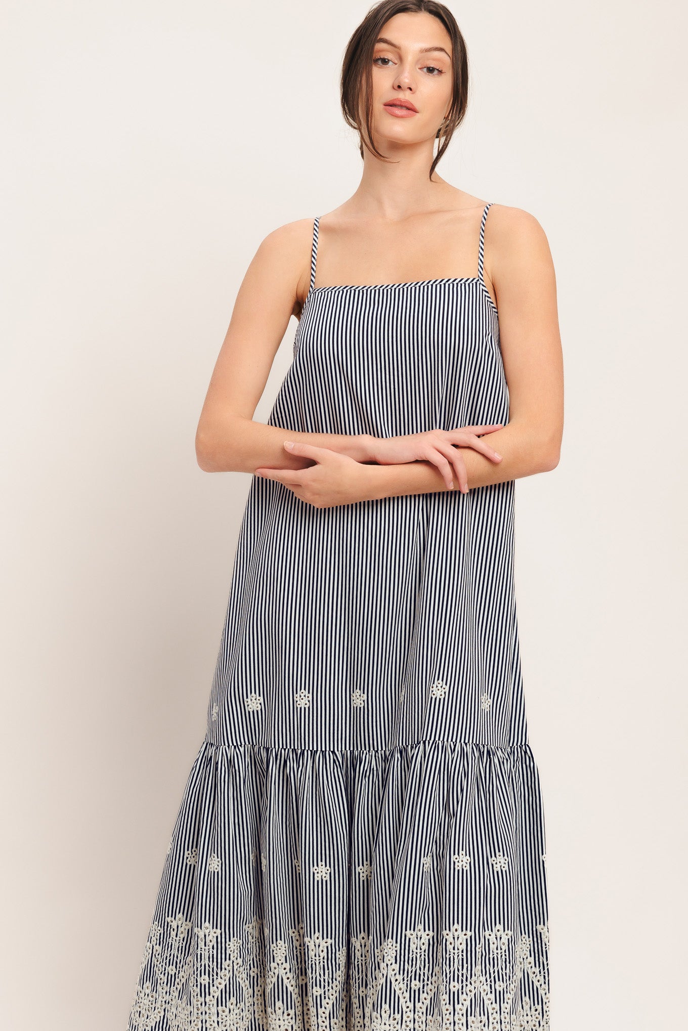 A striped woven midi dress featuring straight neckline, straps, embroidered hem, bare back with tie closure

Details:

Self: 100% Polyester

Size & Fit

-Model is 5`8" And Wearing Size Small
-Measurements Taken From Size Small
-Approx. Length: 51"