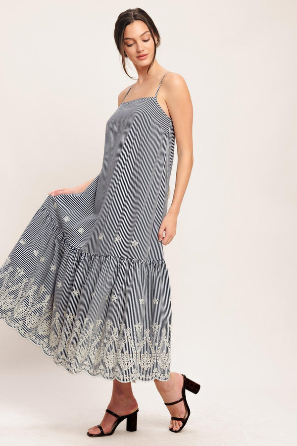 A striped woven midi dress featuring straight neckline, straps, embroidered hem, bare back with tie closure

Details:

Self: 100% Polyester

Size & Fit

-Model is 5`8" And Wearing Size Small
-Measurements Taken From Size Small
-Approx. Length: 51"