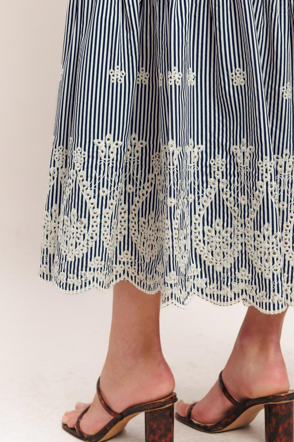 A striped woven midi dress featuring straight neckline, straps, embroidered hem, bare back with tie closure

Details:

Self: 100% Polyester

Size & Fit

-Model is 5`8" And Wearing Size Small
-Measurements Taken From Size Small
-Approx. Length: 51"