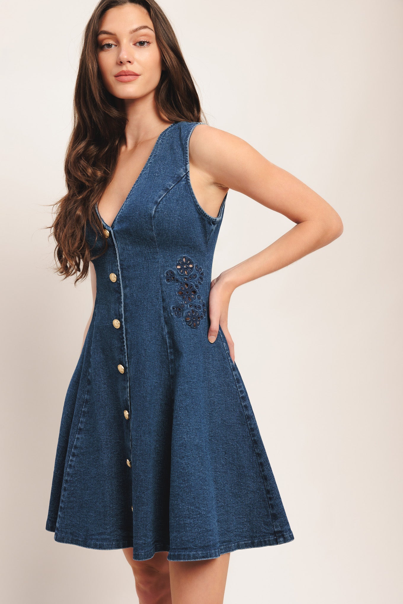 A washed denim mini dress featuring V neckline, sleeveless, non-functional front button down, circle skirt and back zipper closure

Details:

Self: 99% Cotton 1% Spandex

Size & Fit

-Model is 5`8" And Wearing Size Small
-Measurements Taken From Size Small
-Approx. Length: 34"
