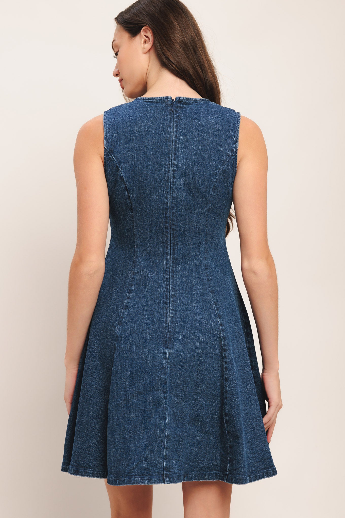 A washed denim mini dress featuring V neckline, sleeveless, non-functional front button down, circle skirt and back zipper closure

Details:

Self: 99% Cotton 1% Spandex

Size & Fit

-Model is 5`8" And Wearing Size Small
-Measurements Taken From Size Small
-Approx. Length: 34"