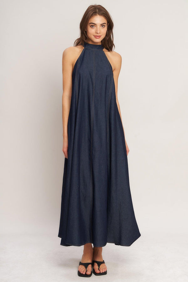 A solid woven midi halter dress with back neck button closure and side pockets
