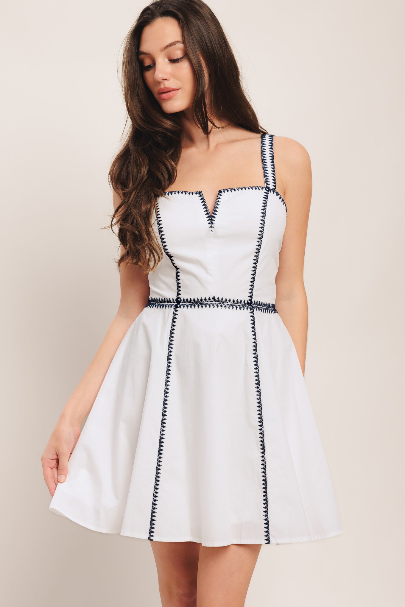 A solid woven mini dress featuring straight neckline with V front, straps, circle skirt, contrasting embroidery and back zipper closure

Details:

Self: 100% Cotton

Lining: 100% Polyester

Size & Fit

-Model is 5`8" And Wearing Size Small
-Measurements Taken From Size Small
-Approx. Length: 34"