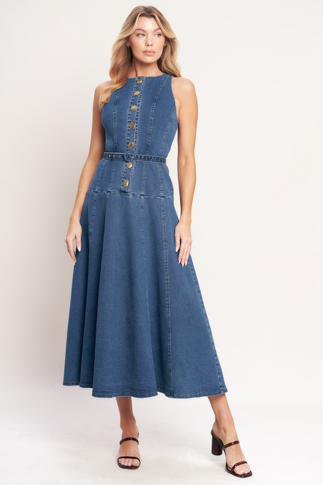 A washed denim mini dress featuring round neckline, sleeveless, button down, self belt and circle skirt

Details:

Self: 70% Cotton 28% Polyester 2% Spandex

Size & Fit

- Model is 5`8" And Wearing Size Small
- Measurements Taken From Size Small
- Approx. Length: 51"