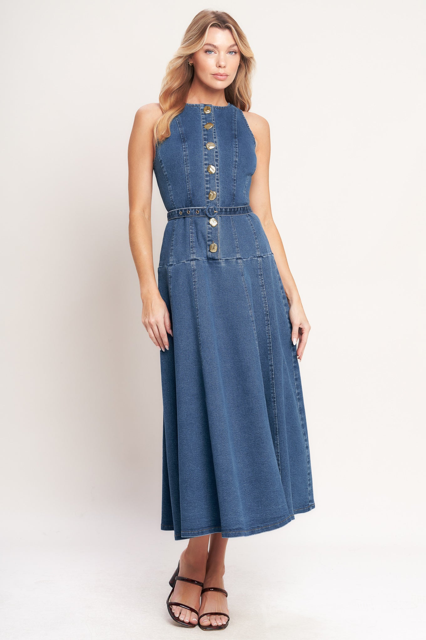 A washed denim mini dress featuring round neckline, sleeveless, button down, self belt and circle skirt

Details:

Self: 70% Cotton 28% Polyester 2% Spandex

Size & Fit

- Model is 5`8" And Wearing Size Small
- Measurements Taken From Size Small
- Approx. Length: 51"