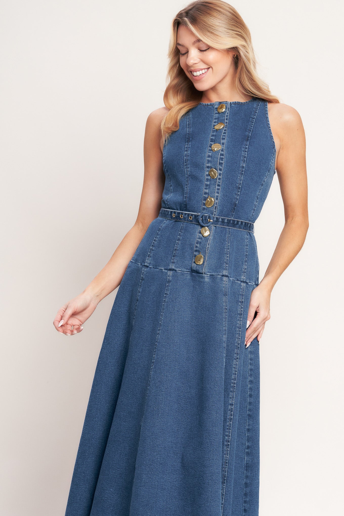 A washed denim mini dress featuring round neckline, sleeveless, button down, self belt and circle skirt

Details:

Self: 70% Cotton 28% Polyester 2% Spandex

Size & Fit

- Model is 5`8" And Wearing Size Small
- Measurements Taken From Size Small
- Approx. Length: 51"