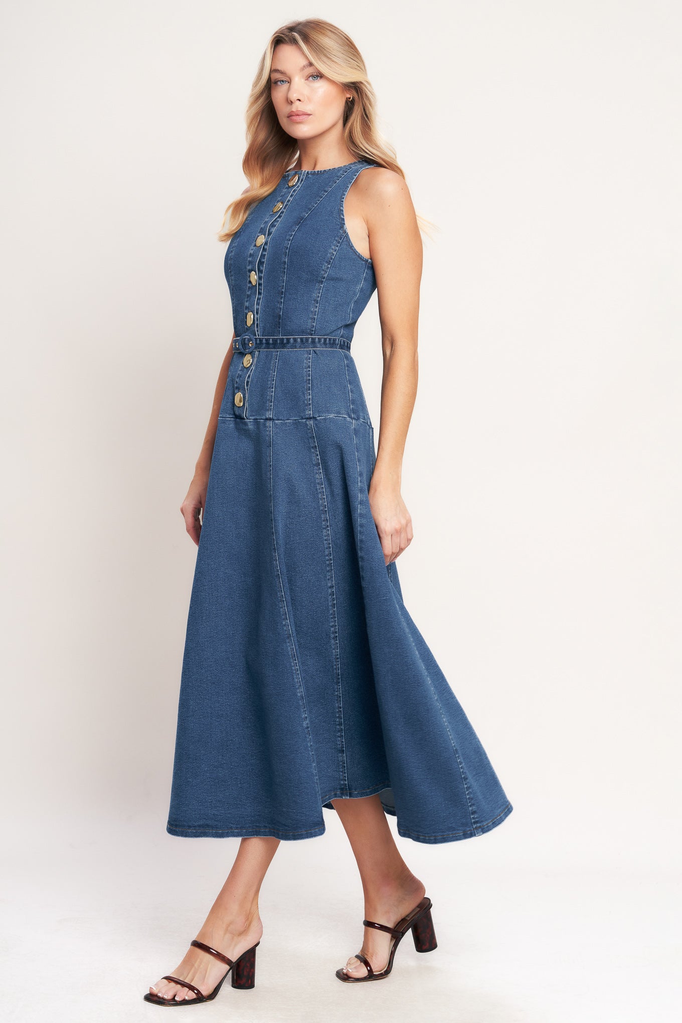 A washed denim mini dress featuring round neckline, sleeveless, button down, self belt and circle skirt

Details:

Self: 70% Cotton 28% Polyester 2% Spandex

Size & Fit

- Model is 5`8" And Wearing Size Small
- Measurements Taken From Size Small
- Approx. Length: 51"