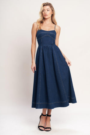 A denim midi dress featuring cami top, full skirt and back zipper closure

Details:

Self: 70% Cotton 28.5% Polyester 1.5% Spandex

Size & Fit

-Model is 5`8" And Wearing Size Small
-Measurements Taken From Size Small
-Approx. Length: 50"