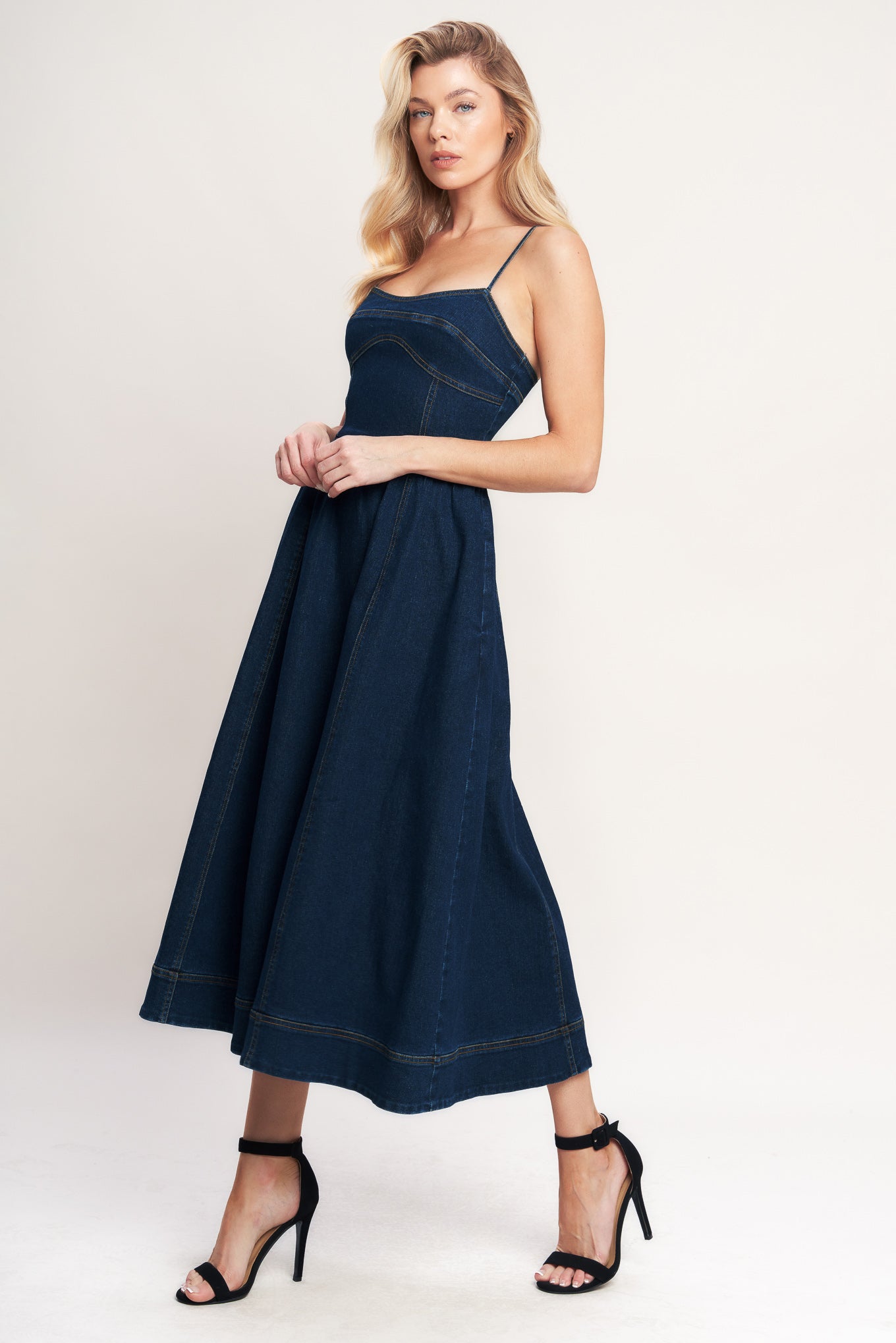 A denim midi dress featuring cami top, full skirt and back zipper closure

Details:

Self: 70% Cotton 28.5% Polyester 1.5% Spandex

Size & Fit

-Model is 5`8" And Wearing Size Small
-Measurements Taken From Size Small
-Approx. Length: 50"