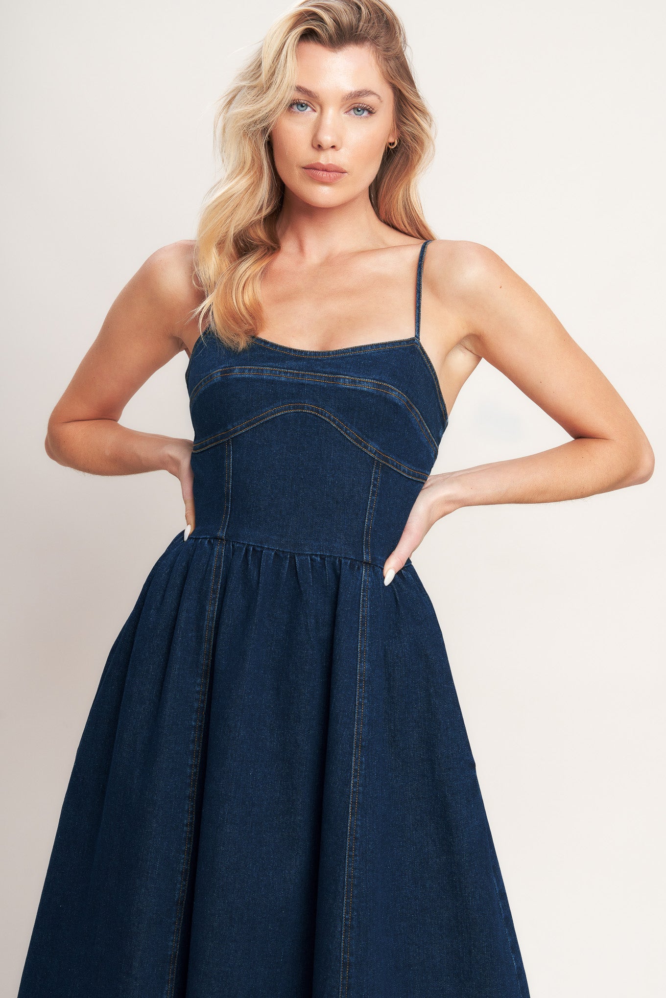 A denim midi dress featuring cami top, full skirt and back zipper closure

Details:

Self: 70% Cotton 28.5% Polyester 1.5% Spandex

Size & Fit

-Model is 5`8" And Wearing Size Small
-Measurements Taken From Size Small
-Approx. Length: 50"