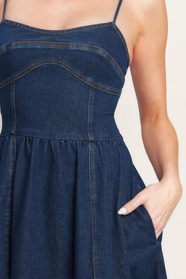 A denim midi dress featuring cami top, full skirt and back zipper closure

Details:

Self: 70% Cotton 28.5% Polyester 1.5% Spandex

Size & Fit

-Model is 5`8" And Wearing Size Small
-Measurements Taken From Size Small
-Approx. Length: 50"
