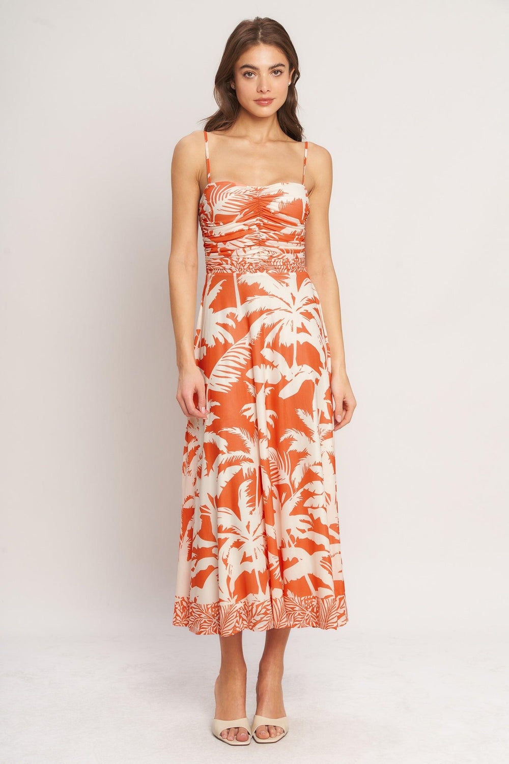 A printed power mesh midi dress featuring straight neckline, straps, shirred bodice, circle skirt and back zipper closure