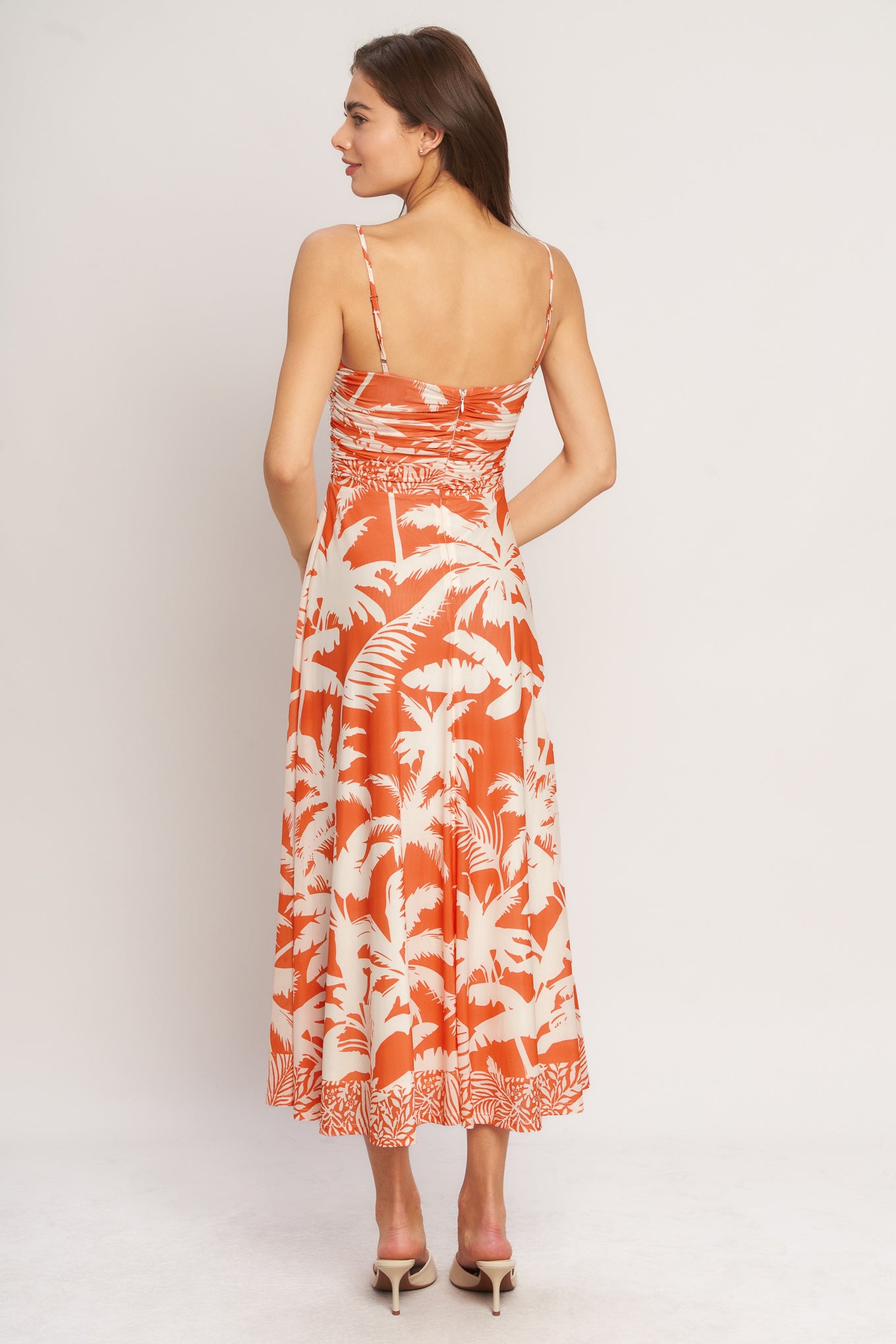 A printed power mesh midi dress featuring straight neckline, straps, shirred bodice, circle skirt and back zipper closure