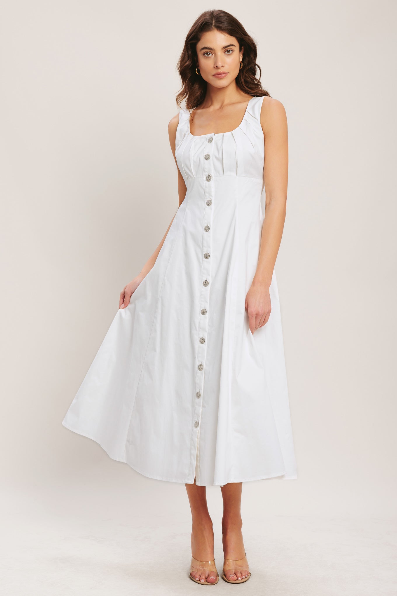 
A solid woven midi dress featuring U neckline with inverted pleated bodice, front button down and circle skirt

Details:

Self : 97% Cotton 3% Spandex
Lining : 100% Polyester

Size &amp; Fit

- Model is 5`8" And Wearing Size Small
- Measurements Taken From Size Small
- Approx. Length: 50"