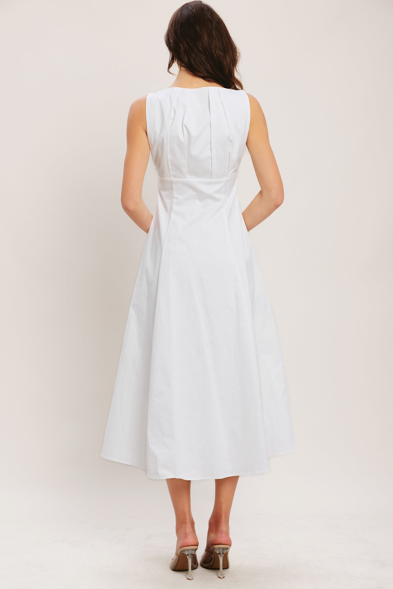 
A solid woven midi dress featuring U neckline with inverted pleated bodice, front button down and circle skirt

Details:

Self : 97% Cotton 3% Spandex
Lining : 100% Polyester

Size &amp; Fit

- Model is 5`8" And Wearing Size Small
- Measurements Taken From Size Small
- Approx. Length: 50"