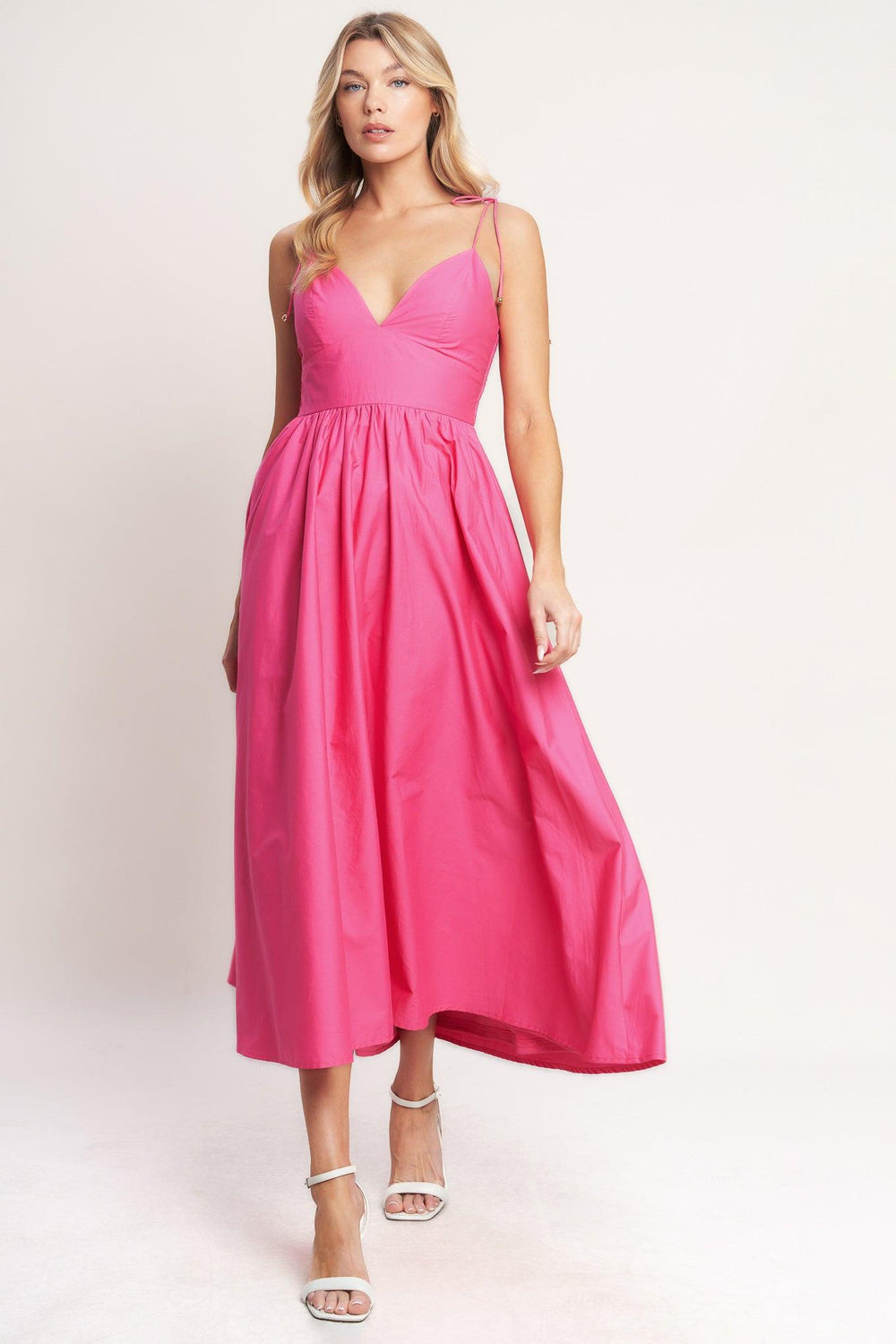 
A solid woven midi dress featuring cami top with shoulder tie, waist yoke, full skirt and smocked back bodice

Details:

Self : 100% Cotton
Lining : 100% Polyester

Size &amp; Fit

- Model is 5`8" And Wearing Size Small
- Measurements Taken From Size Small
- Approx. Length: 51"