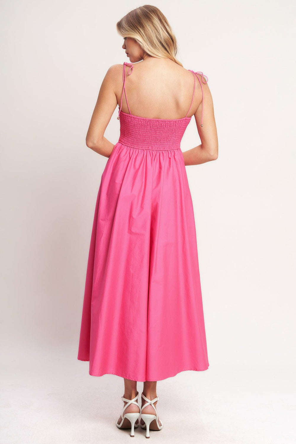 
A solid woven midi dress featuring cami top with shoulder tie, waist yoke, full skirt and smocked back bodice

Details:

Self : 100% Cotton
Lining : 100% Polyester

Size &amp; Fit

- Model is 5`8" And Wearing Size Small
- Measurements Taken From Size Small
- Approx. Length: 51"